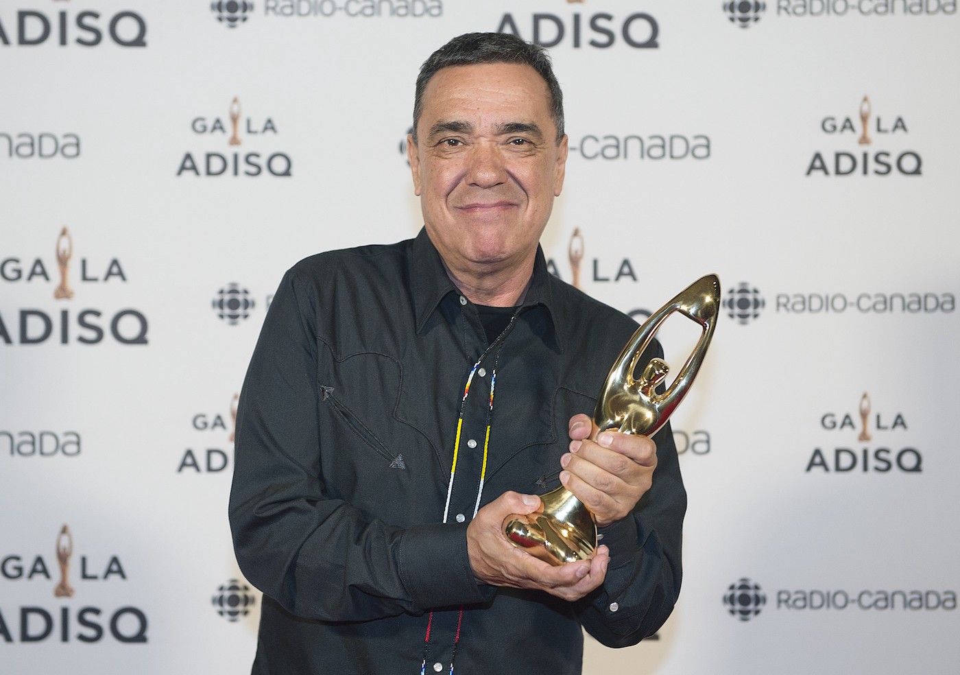 Florent Vollant holds up his award at the Gala Adisq awards ceremony in Montreal, Sunday, October 27, 2019.THE CANADIAN PRESS/Graham Hughes