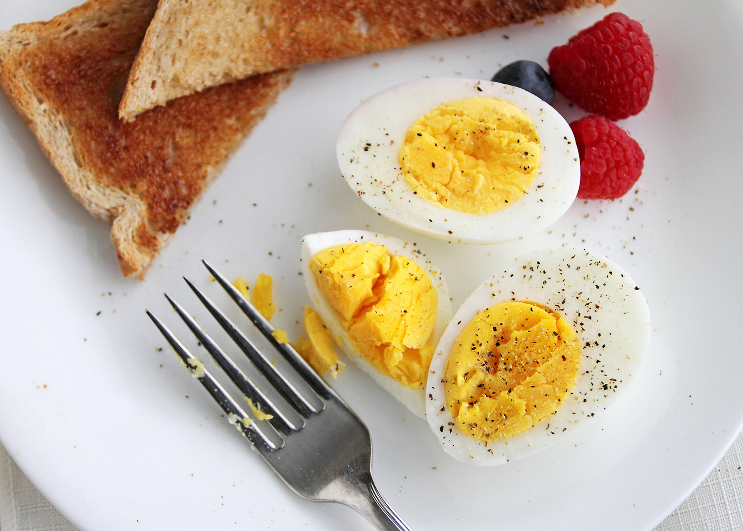 Hard boiled egg breakfast with salt and pepper.