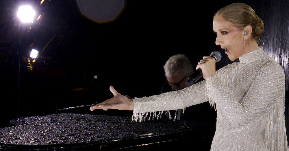 PARIS, FRANCE - JULY 26: (EDITOR'S NOTE: This Handout screengrab was provided by a third-party organization and may not adhere to Getty Images' editorial policy.) This handout released by the Olympic Broadcasting Services, shows a view of singer Celine Dion performing on the Eiffel Tower during the opening ceremony of the Paris 2024 Olympic Games Paris 2024 on July 26, 2024 in Paris, France. (Screengrab by IOC via Getty Images)