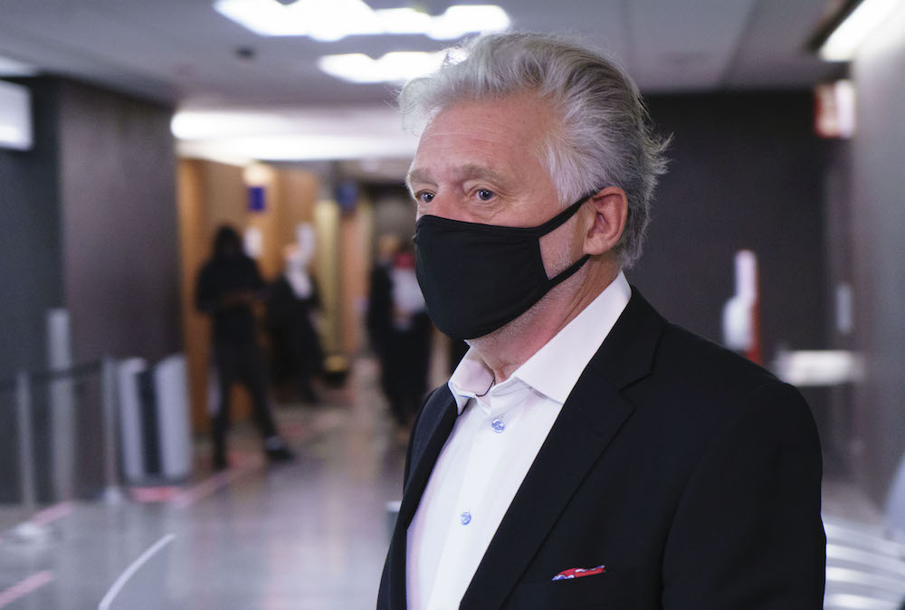 Just for Laughs founder Gilbert Rozon walks the hall of the courthouse as he arrives for the beginning of his sexual assault trial in Montreal on Tuesday, October 13, 2020. THE CANADIAN PRESS/Paul Chiasson