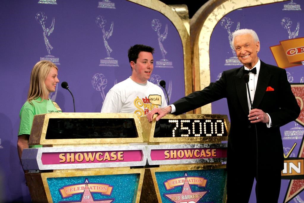 FILE - Host Bob Barker appears with contestants during filming of a special prime-time episode of "The Price Is Right," in Los Angeles on April 17, 2007. Actor-comedian Drew Carey replaced Barker on “The Price is Right” in 2007. (AP Photo/Kevork Djansezian, File)