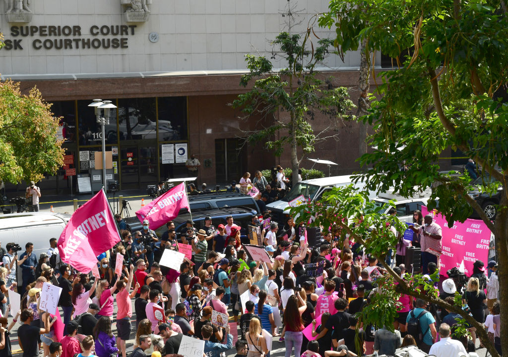 LOS ANGELES, CALIFORNIA - SEPTEMBER 29: #FreeBritney activists protest during a rally held in conjunction with a hearing on the future of Britney Spears' conservatorship at the Stanley Mosk Courthouse on September 29, 2021 in Los Angeles, California. Spears was placed in a conservatorship managed by her father, Jamie Spears, and an attorney, which controls her assets and business dealings, following her involuntary hospitalization for mental care in 2008. Spears and her father have asked the court to remove him from his role in the conservatorship. (Photo by Chelsea Guglielmino/Getty Images)