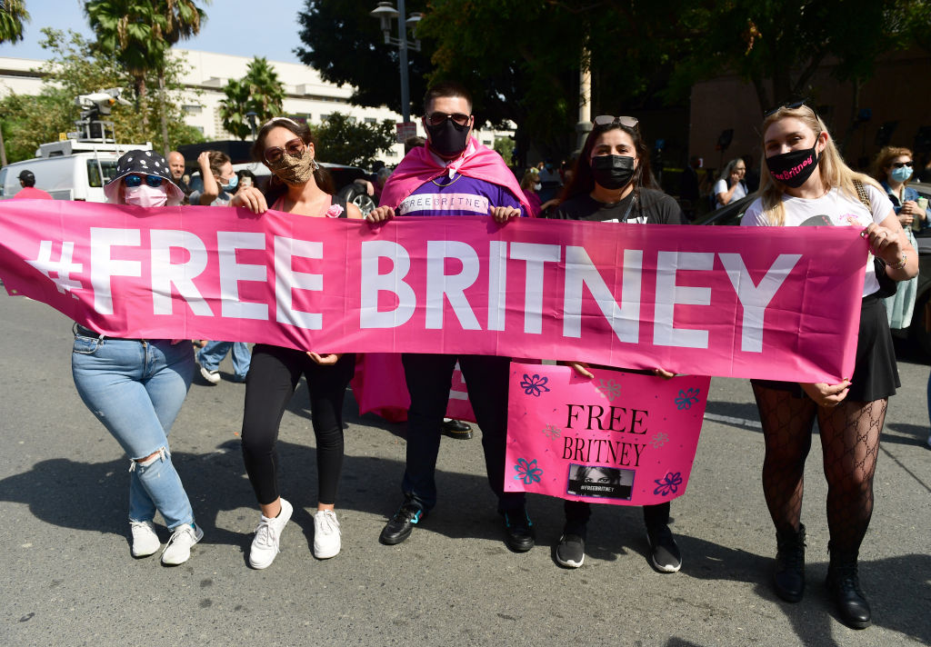 LOS ANGELES, CALIFORNIA - SEPTEMBER 29: #FreeBritney activists protest during a rally held in conjunction with a hearing on the future of Britney Spears' conservatorship at the Stanley Mosk Courthouse on September 29, 2021 in Los Angeles, California. Spears was placed in a conservatorship managed by her father, Jamie Spears, and an attorney, which controls her assets and business dealings, following her involuntary hospitalization for mental care in 2008. Spears and her father have asked the court to remove him from his role in the conservatorship. (Photo by Chelsea Guglielmino/Getty Images)