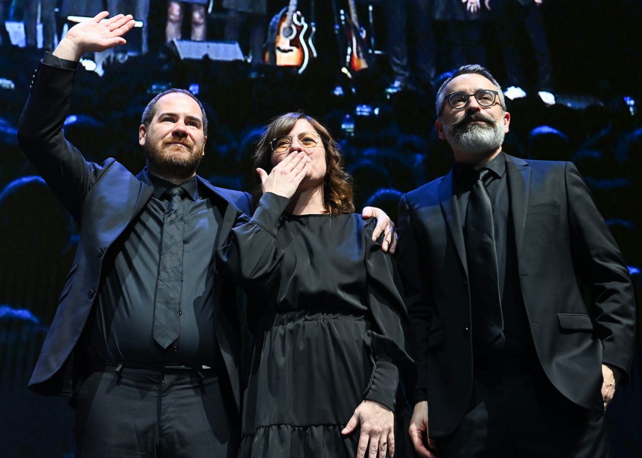 Members of Les Cowboys Fringants salute the crowd following an event paying tribute to the late Karl Tremblay, lead singer with the band, in Montreal, Tuesday, November 28, 2023. THE CANADIAN PRESS/Graham Hughes 