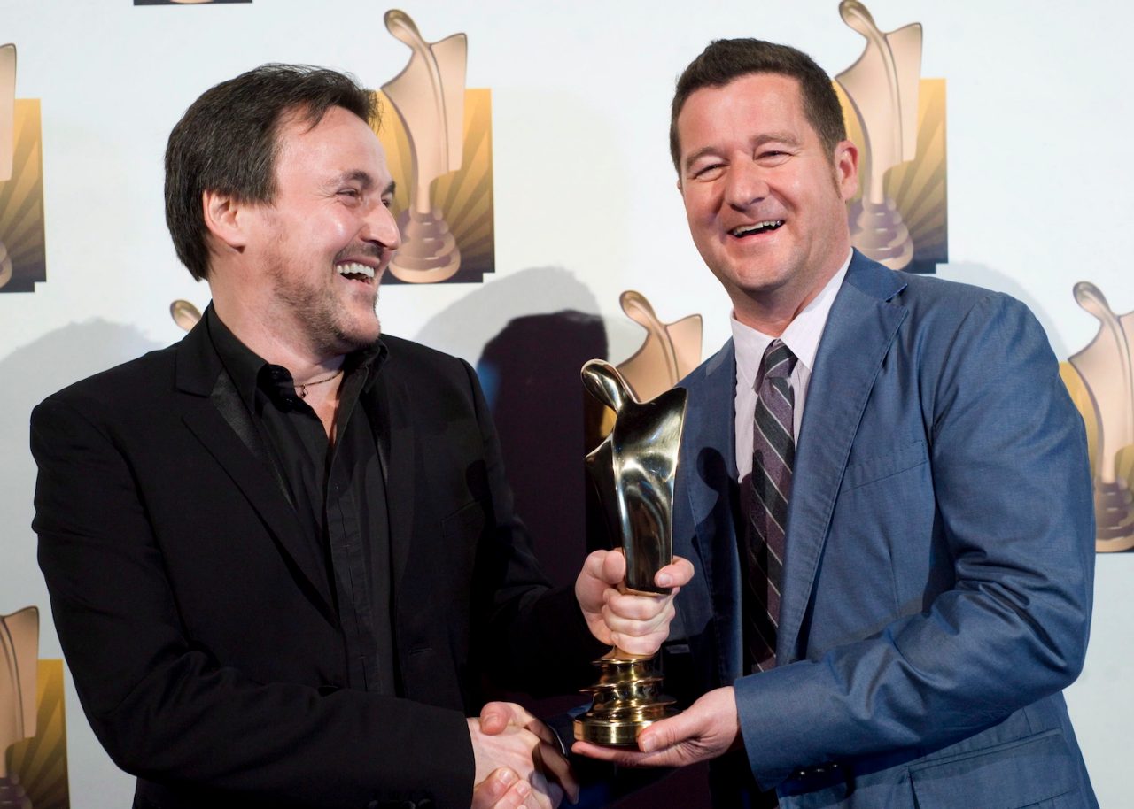 Guy A Lepage and Dany Turcotte smile after winning for best talk show hosts at the Gala Artis awards show in Montreal, Sunday, April, 22, 2012. THE CANADIAN PRESS/Graham Hughes