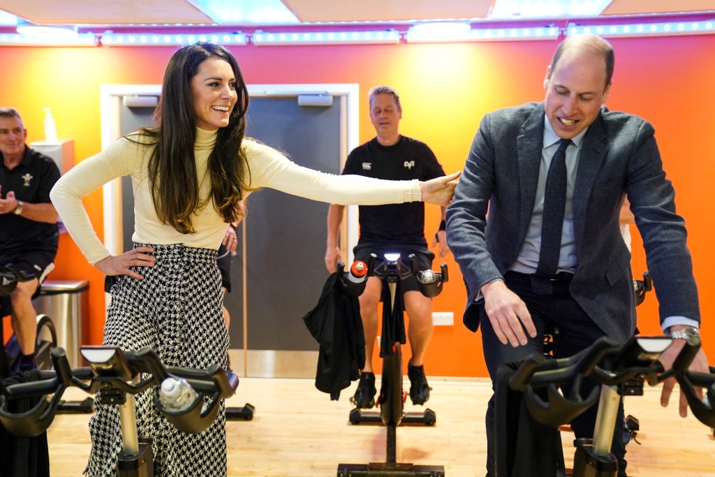 Britain's Catherine, Princess of Wales (L) and Britain's Prince William, Prince of Wales (R) take part in a spin class during a visit to the Aberavon Leisure and Fitness Centre in Port Talbot, on February 28, 2023 to meet local communities and hear about how sport and exercise can support mental health and wellbeing. (Photo by Jacob King / POOL / AFP) (Photo by JACOB KING/POOL/AFP via Getty Images)
