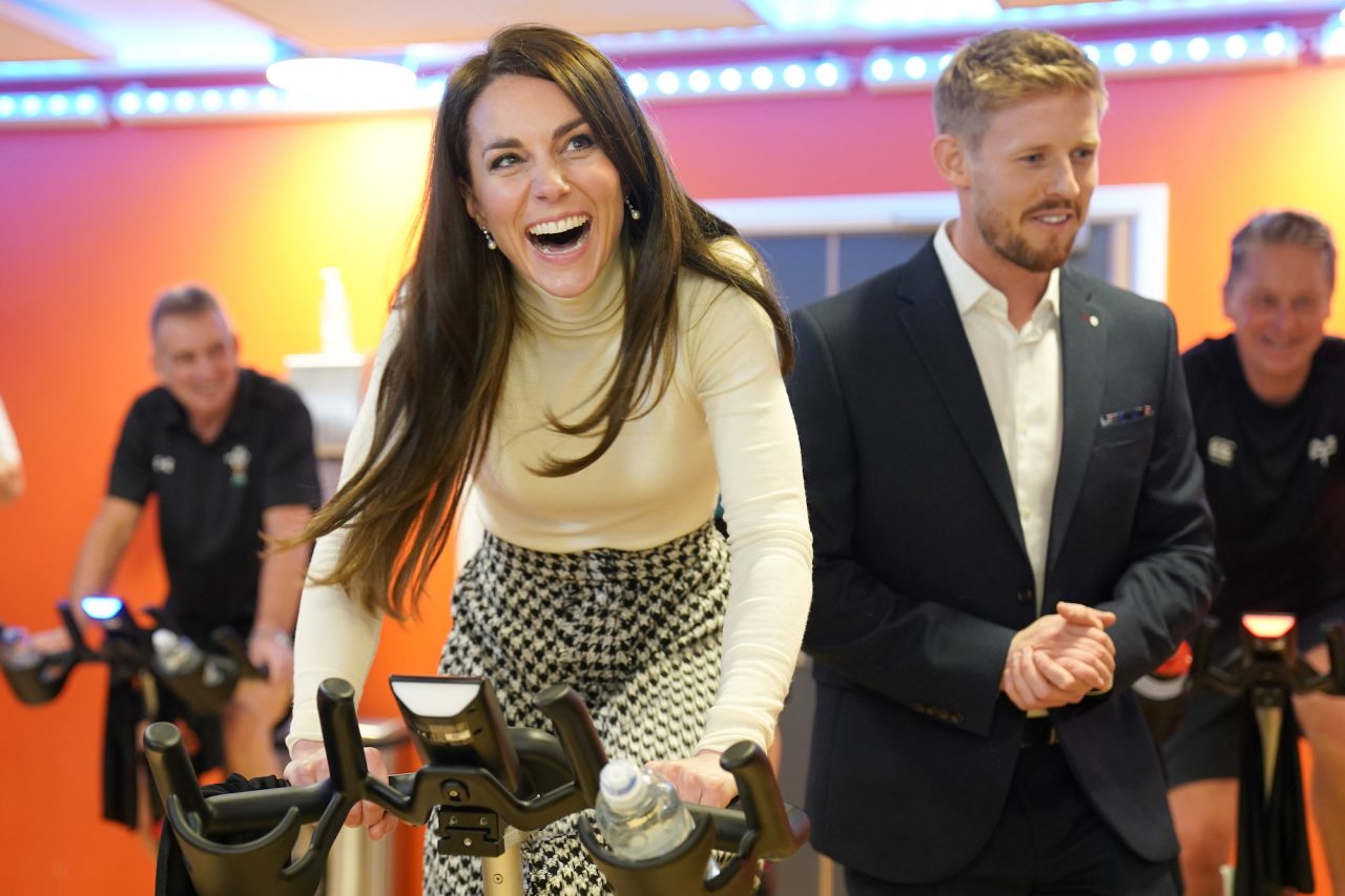 PORT TALBOT, WALES - FEBRUARY 28: Catherine, Princess of Wales takes part in a spin class during a visit to Aberavon Leisure and Fitness Centre in Port Talbot, to meet local communities and hear about how sport and exercise can support mental health and wellbeing on February 28, 2023 in Port Talbot, United Kingdom. The Prince and Princess of Wales are visiting communities and mental health initiatives in South Wales ahead of St David's Day, which takes place on March 1. (Photo by Jacob King - WPA Pool/Getty Images)