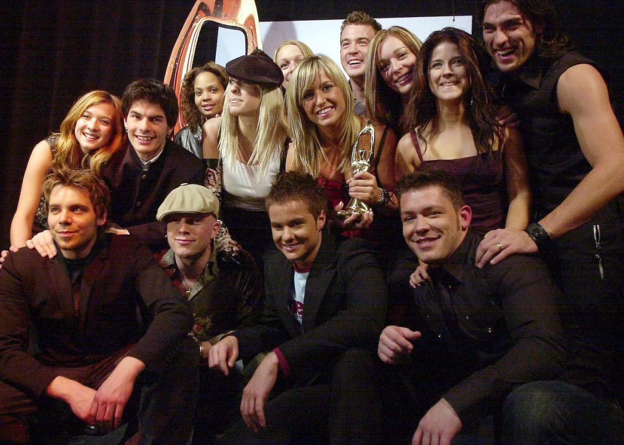  Star Academie reality TV show contestants - including winner Wilfred LeBouthilier (bottom, second from right) - pose with a Felix trophy for top selling album during the ADISQ Gala in Montreal, on Sunday October 26, 2003. (CP PHOTO/Francois Roy)
