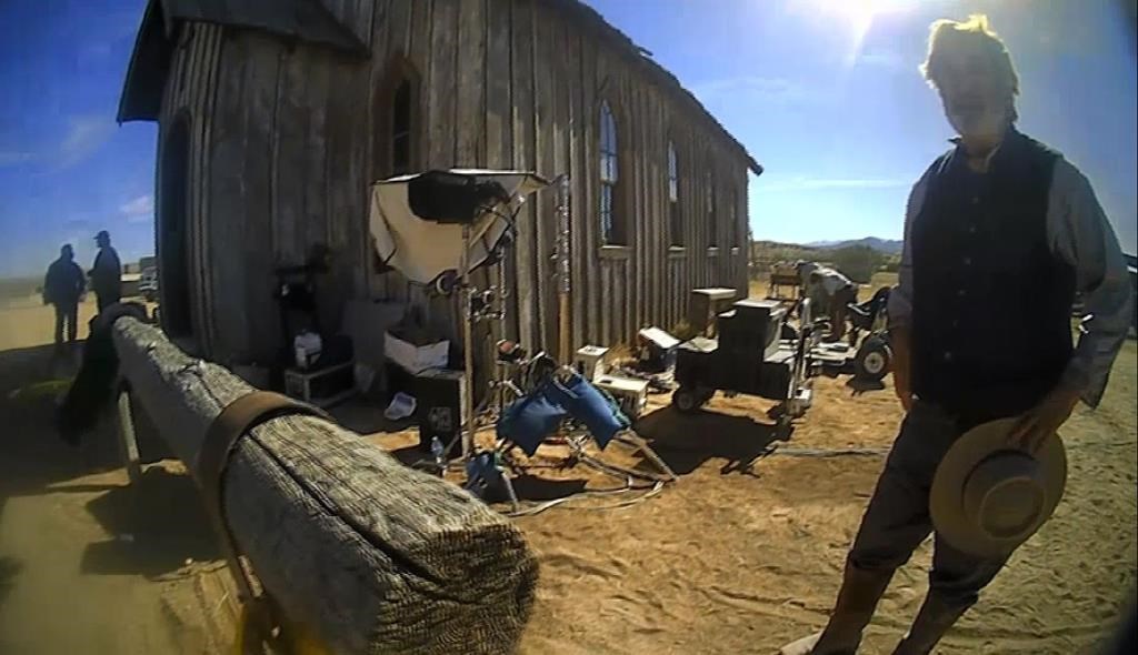 FILE - In this image from video released by the Santa Fe County Sheriff's Office, Alec Baldwin speaks with investigators following a fatal shooting on a movie set in Santa Fe, N.M. Filming on the Western movie "Rust" is scheduled to resume at a movie ranch in Montana in the aftermath of the fatal shooting of a cinematographer by actor Alec Baldwin during a rehearsal on the original production in New Mexico. (Santa Fe County Sheriff's Office via AP, File)