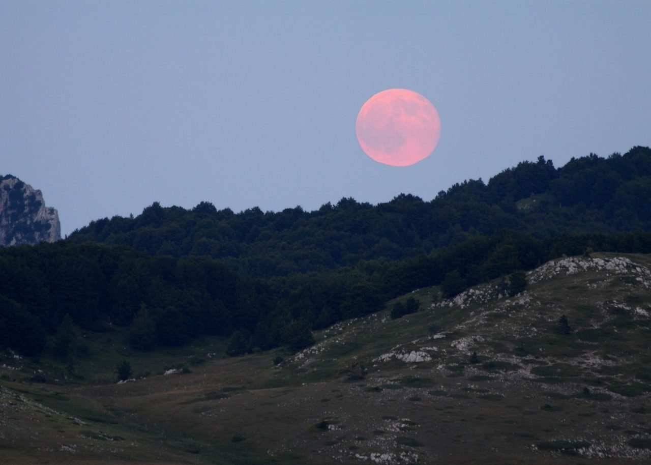 The pink full moon rises over Gran Sasso Laga National Park, July 2015.