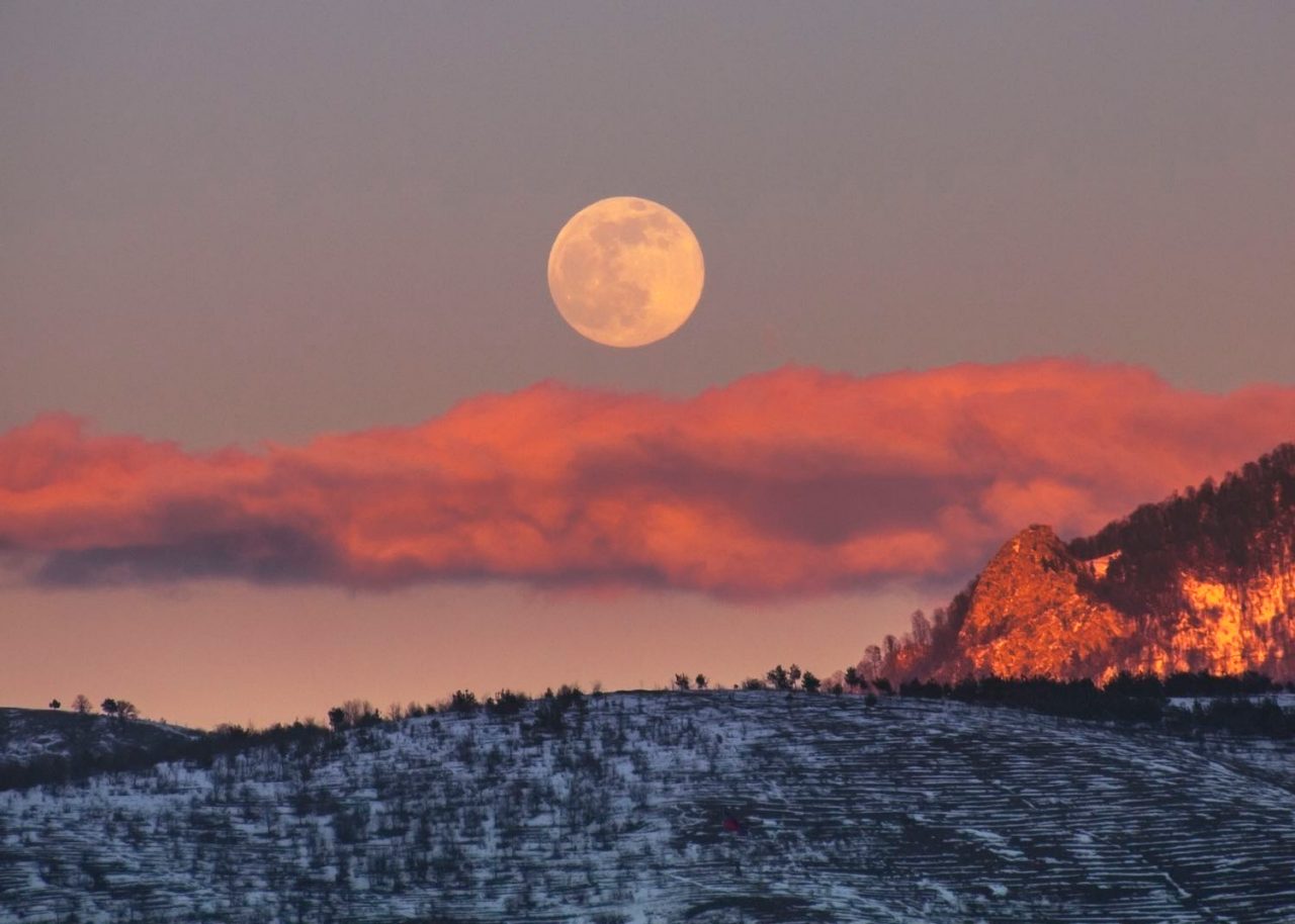 Full moon rising over a winter dream landscape