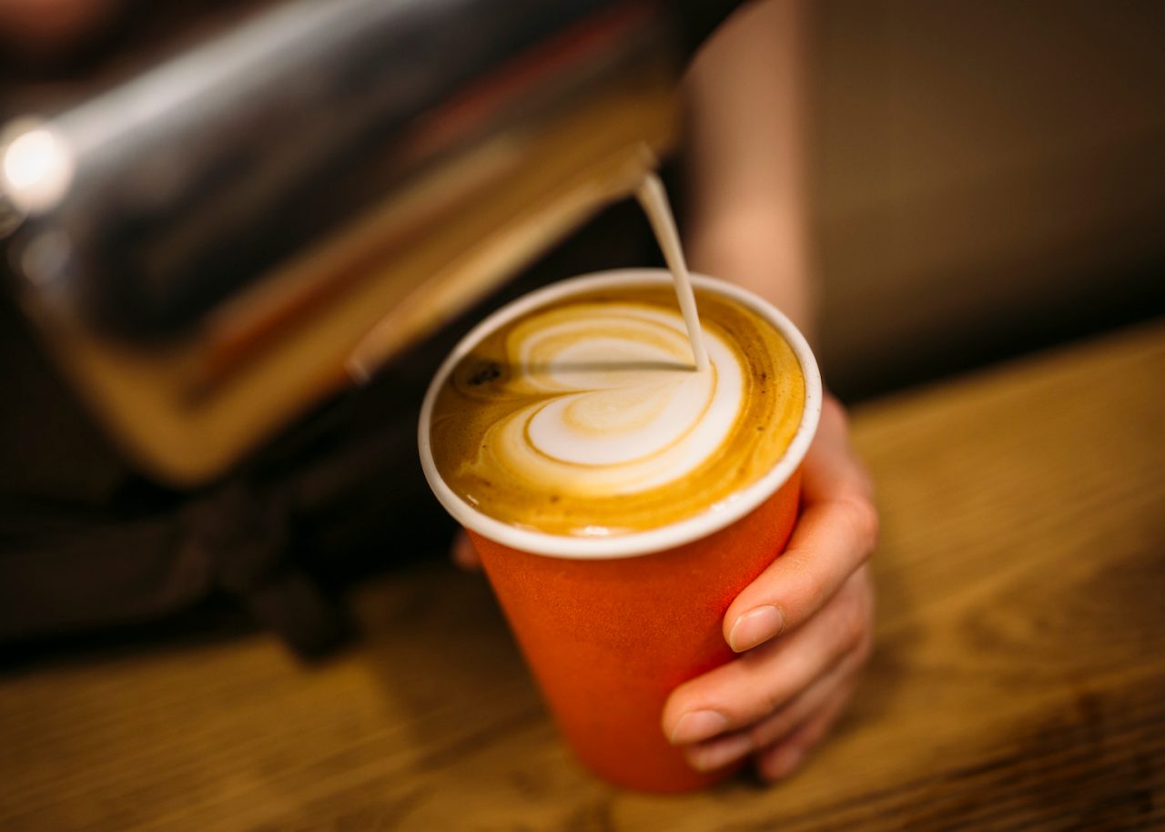 Latte art in a takeaway cup