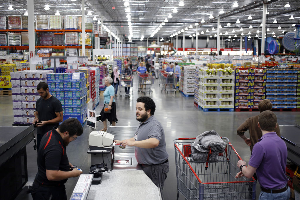 An employee scans a customer's membership card in a check-out line at a Costco Wholesale Corp. store in Louisville, Kentucky, U.S., on Wednesday, May 29, 2019. Costco is scheduled to release earnings figures on May 30. Photographer: Luke Sharrett/Bloomberg via Getty Images