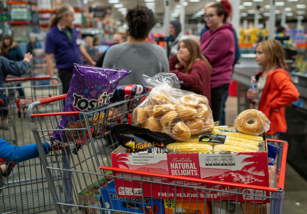 COLCHESTER, VERMONT - NOVEMBER 13: A family moves through the check out lane with its groceries at a Costco Wholesale store November 13, 2023 in Colchester, Vermont. (Photo by Robert Nickelsberg/Getty Images)