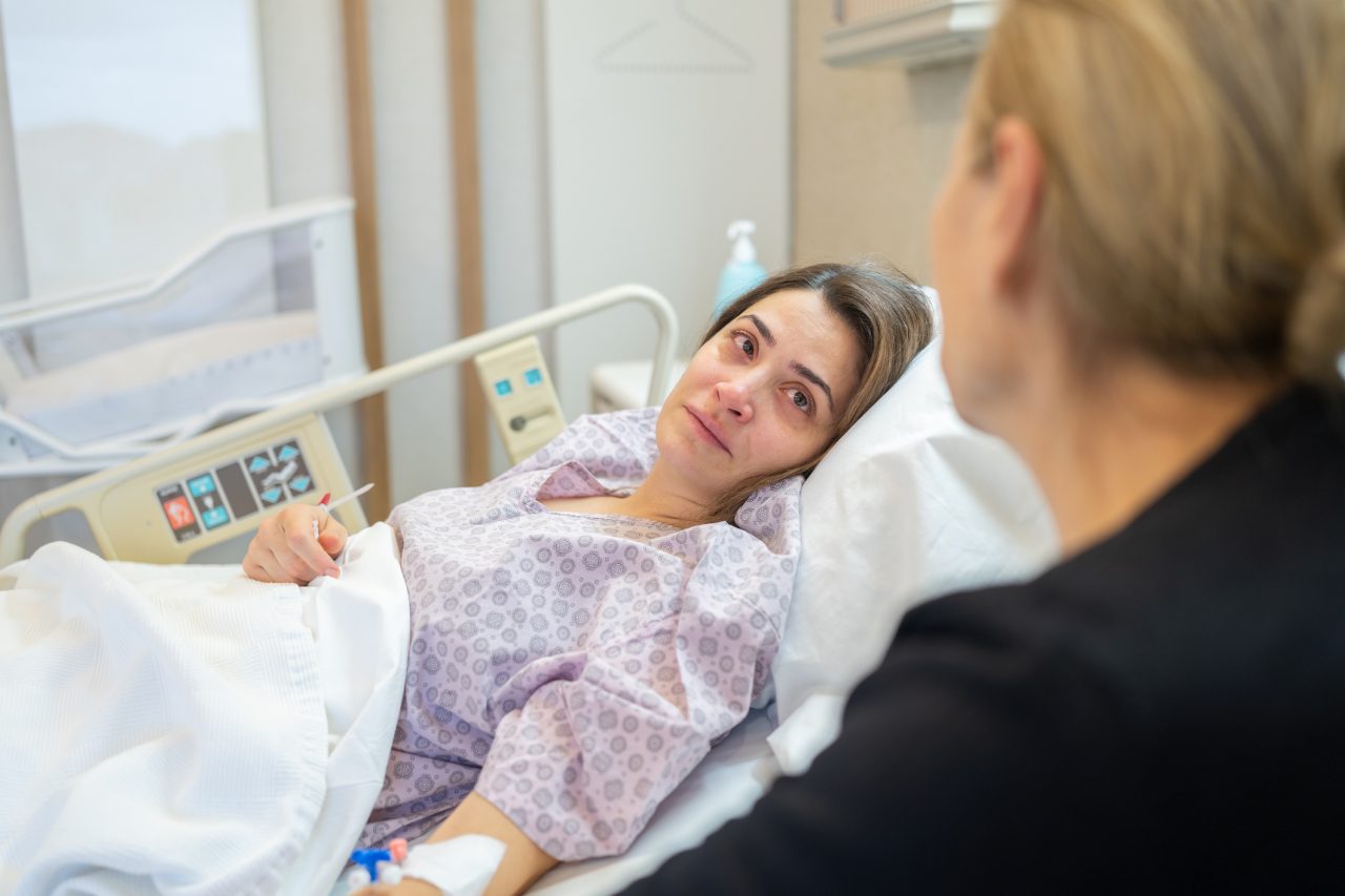Female Patient Looking At Her Mother Ä°n Hospital Bed